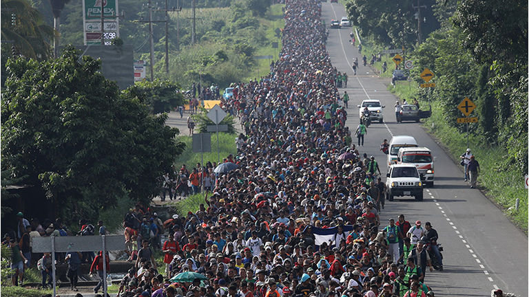 A migrant caravan, which has grown into the thousands, walks into the interior of Mexico after crossing the Guatemalan border