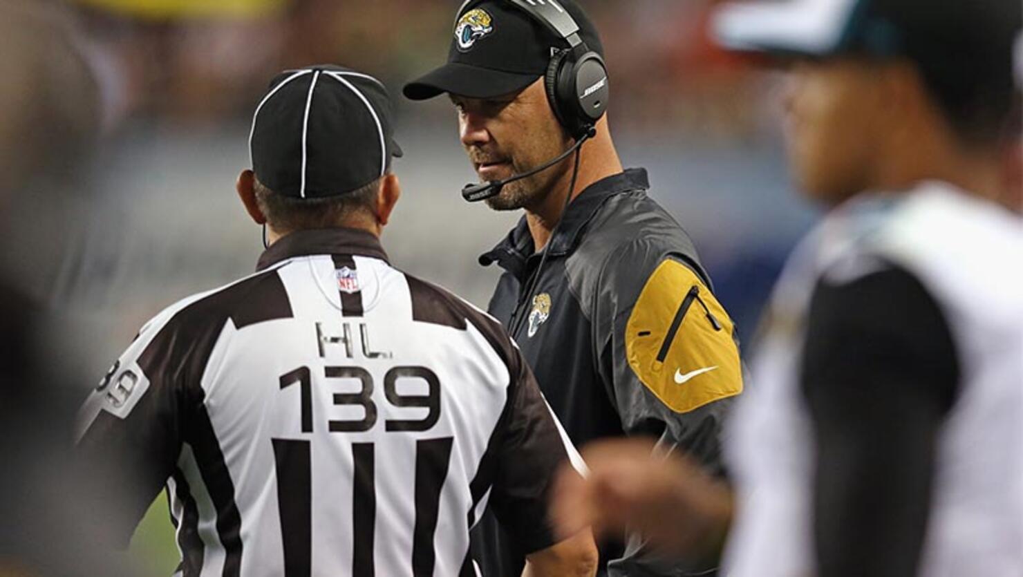  Head Coach Gus Bradley of the Jacksonville Jaguars talks with Head Linesman Hugo Cruz #139