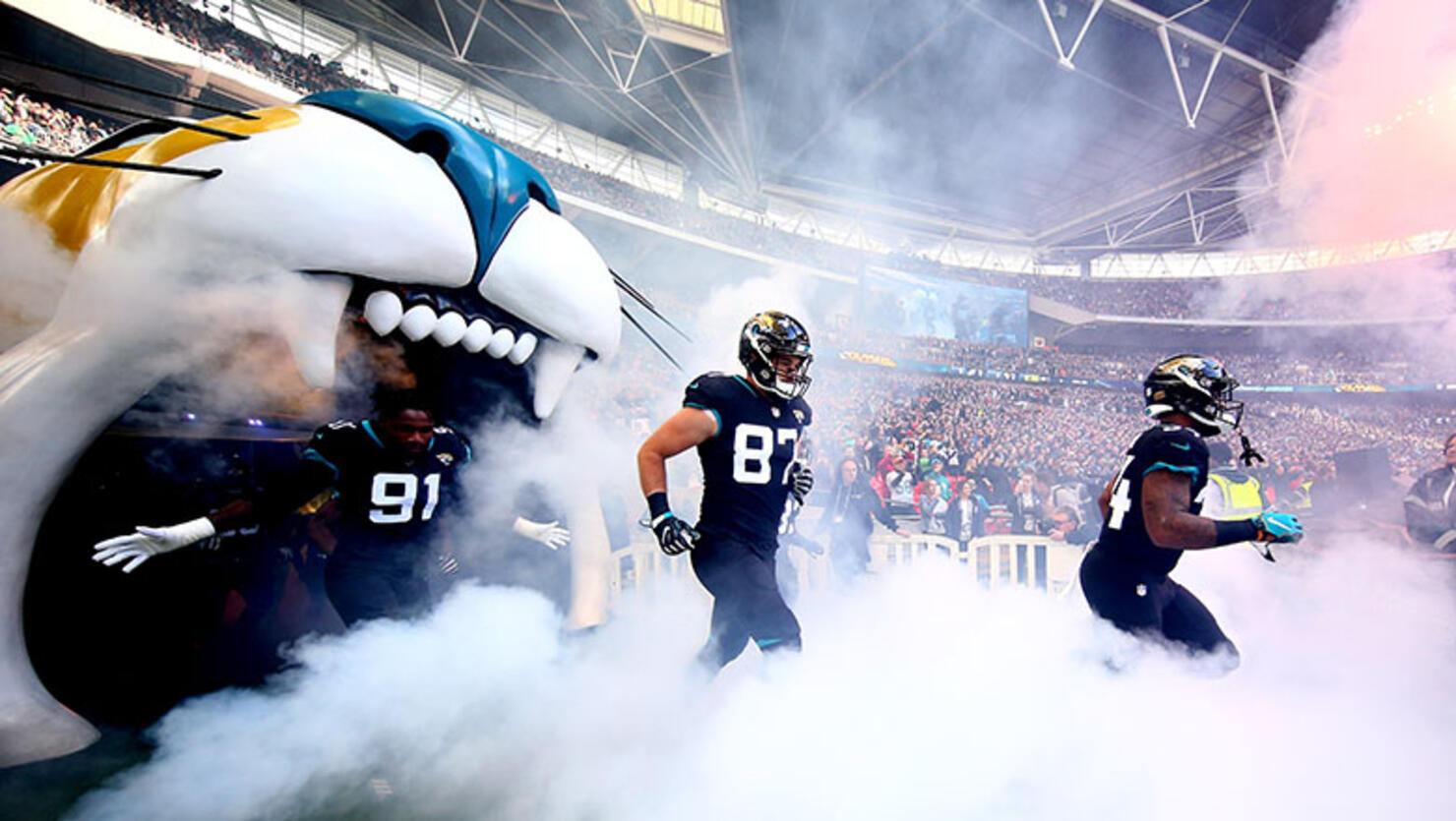 The Jacksonville Jaguars run onto the pitch during the NFL International Series game between Philadelphia Eagles and Jacksonville Jaguars at Wembley Stadium