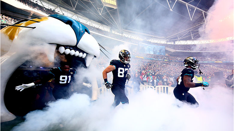 The Jacksonville Jaguars run onto the pitch during the NFL International Series game between Philadelphia Eagles and Jacksonville Jaguars at Wembley Stadium