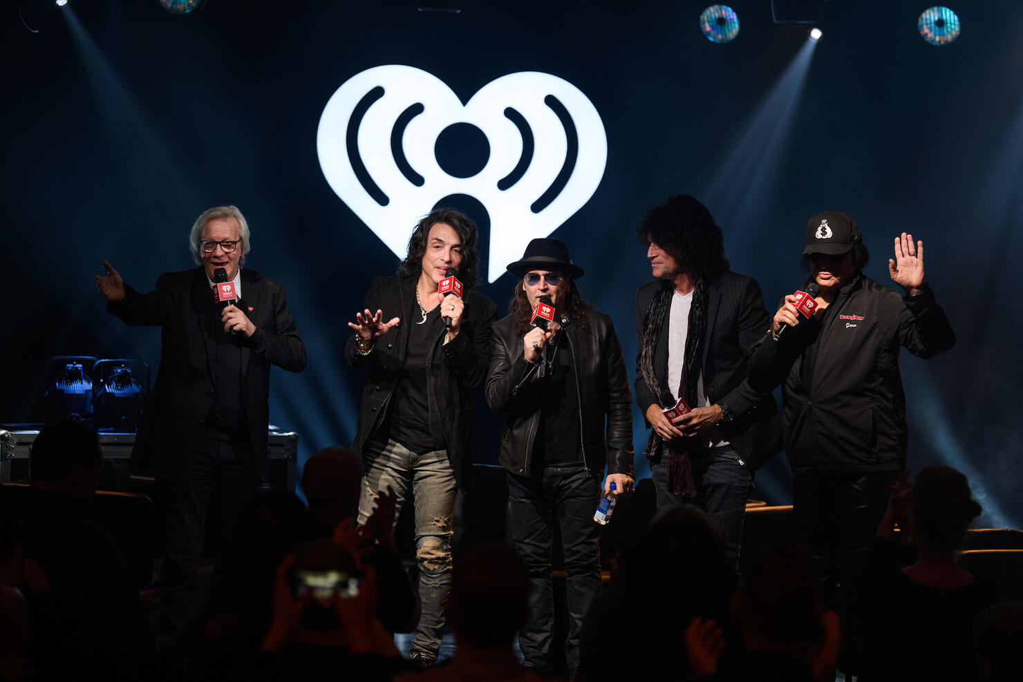 iHeartRadio's Jim Kerr with Paul Stanley, Eric Singer, Tommy Thayer and Gene Simmons. (Photo credit: Chris Owyoung for iHeartRadio)