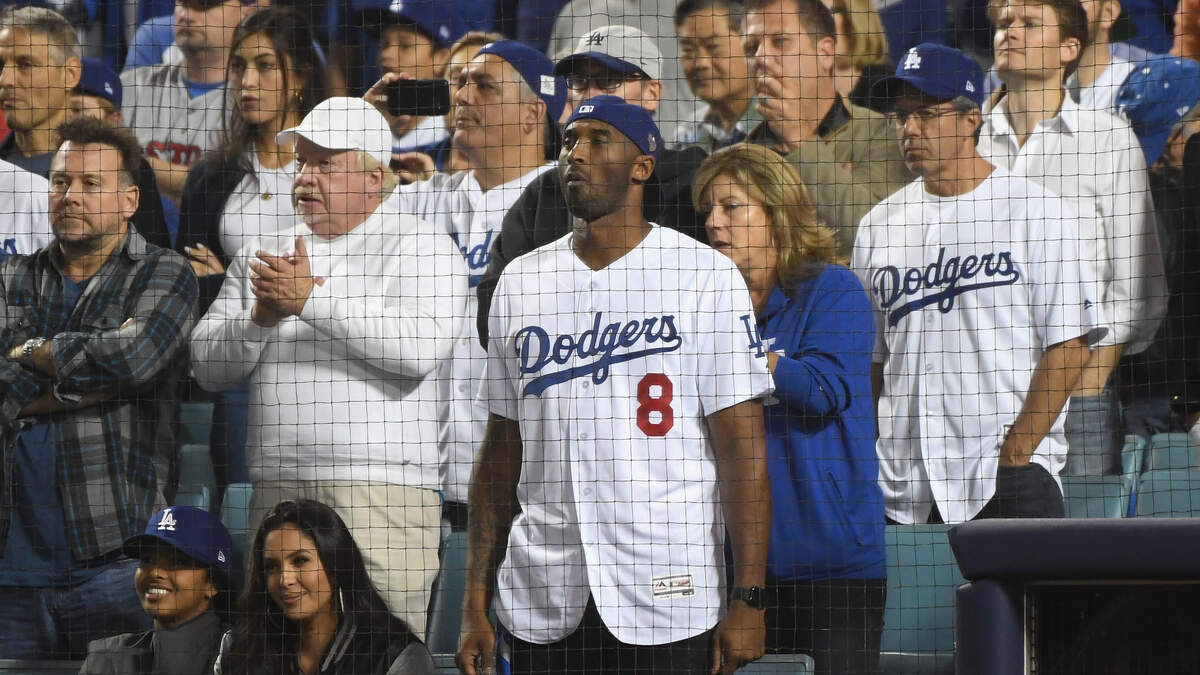 Kobe Bryant reacts as Yasiel Puig of the Los Angeles Dodgers