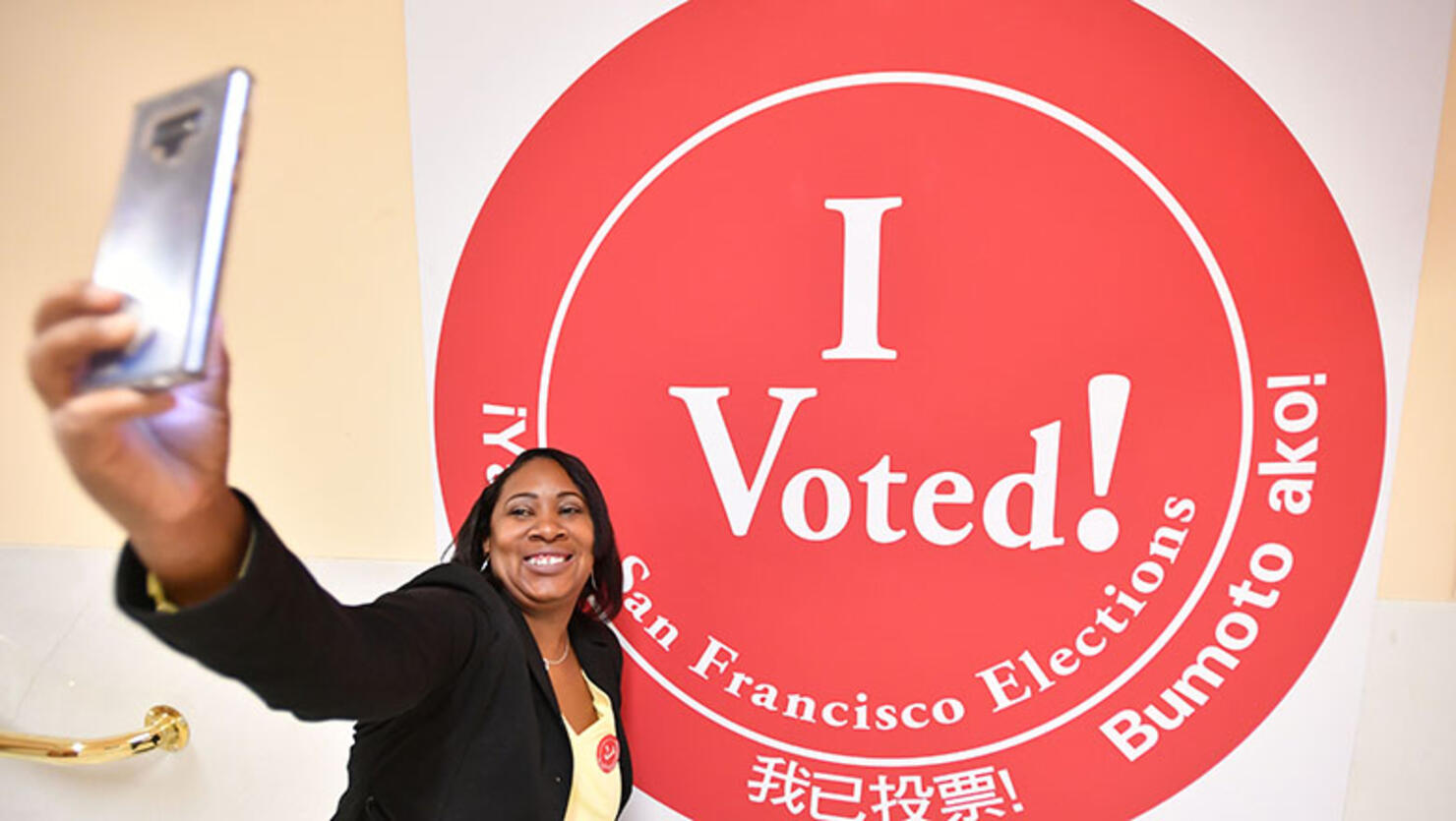 A woman takes a selfie after voting at City Hall in San Francisco, California on November 6, 2018