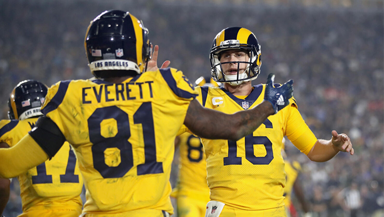 Quarterback Jared Goff #16 of the Los Angeles Rams celebrates a touchdown by teammate Gerald Everett #81 during the fourth quarter of the game against the Kansas City Chiefs at Los Angeles Memorial Coliseum