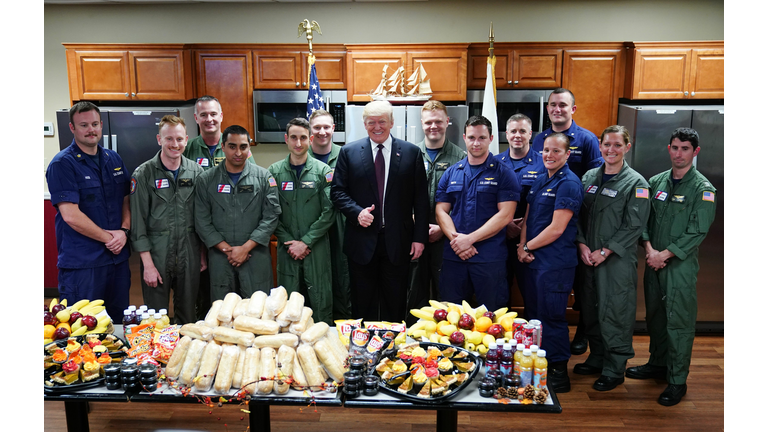 US President Donald Trump poses as he visits with personnel at US Coast Guard Station Lake Worth Inlet in Riviera Beach, Florida, on Thanksgiving Day, November 22, 2018.  (Photo credit MANDEL NGAN/AFP/Getty Images)