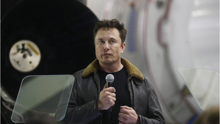 SpaceX CEO Elon Musk speaks at a press conference at SpaceX headquarters where he announced the Japanese billionaire chosen by the company to fly around the moon