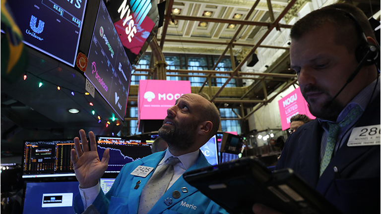 Traders work on the floor of the New York Stock Exchange (NYSE)