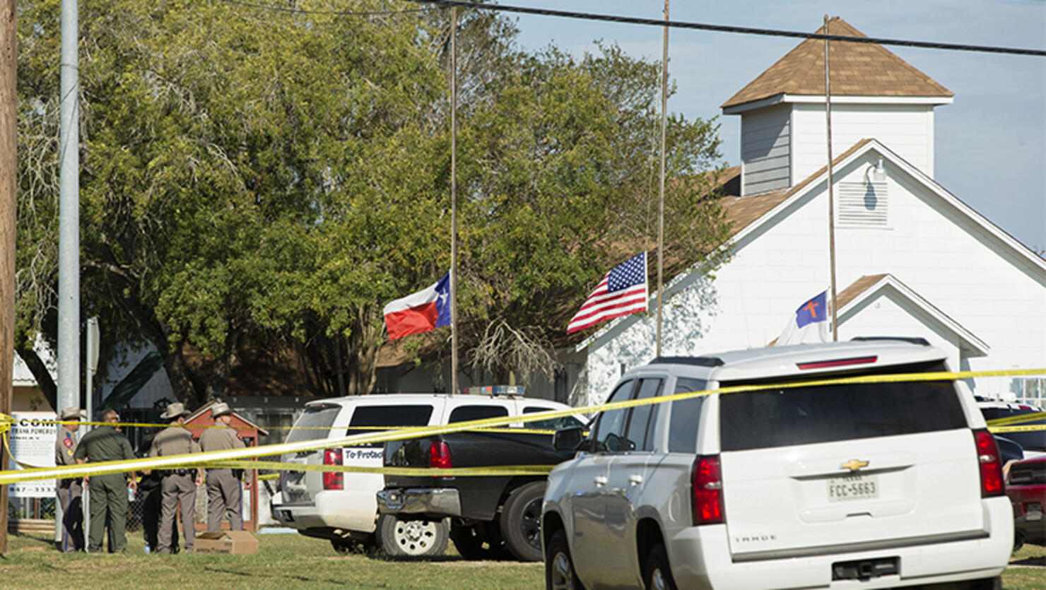 Law enforcement officials gather near the First Baptist Church following a shooting on November 5, 2017 in Sutherland Springs, Texas