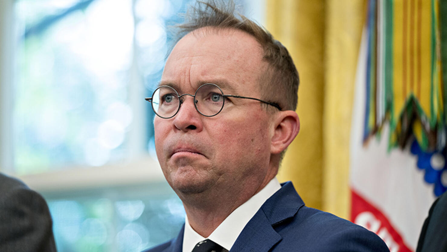 Mick Mulvaney, director of the Office of Management and Budget (OMB), listens during a meeting with U.S. President Donald Trump