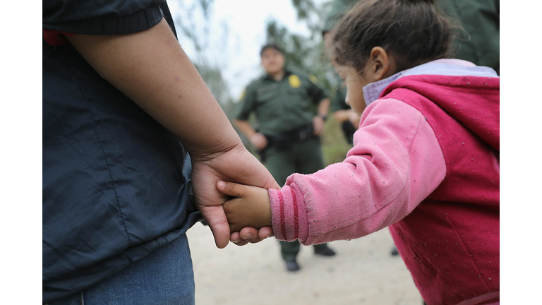 Immigrants Surge Across Border Ahead Of Trump Inauguration MCALLEN, TX - JANUARY 04: U.S. Border Patrol agents take Central American immigrants into custody on January 4, 2017 near McAllen, Texas. Thousands of families and unaccompanied children, most from Central America, are crossing the border illegally to request asylum in the U.S. from violence and poverty in their home countries. The number of immigrants coming across has surged in advance of President-elect Donald Trump's inauguration January 20. He has pledged to build a wall along the U.S.-Mexico border. (Photo by John Moore/Getty Images)