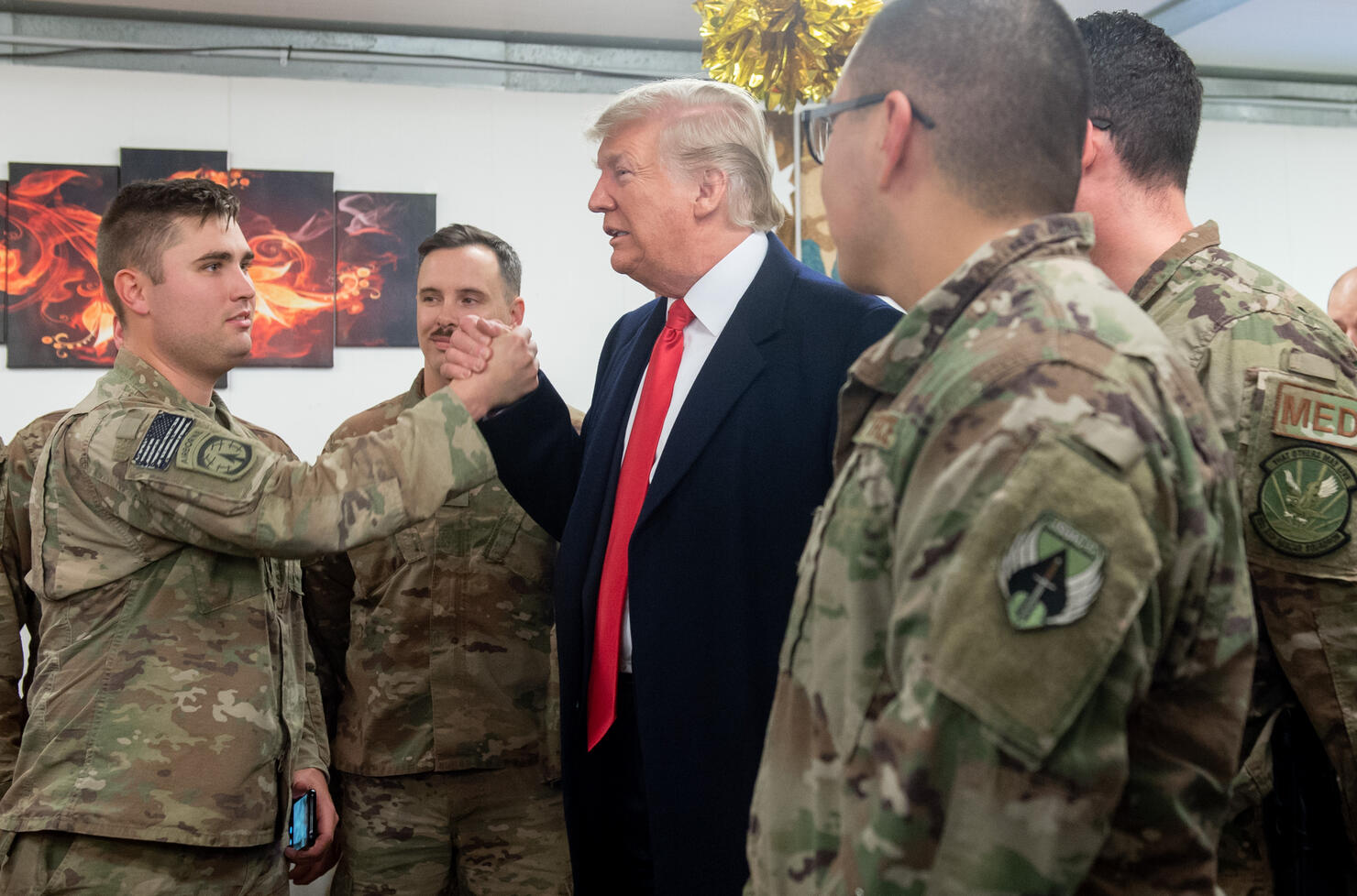 President Trump makes surprise visit to troops in Iraq