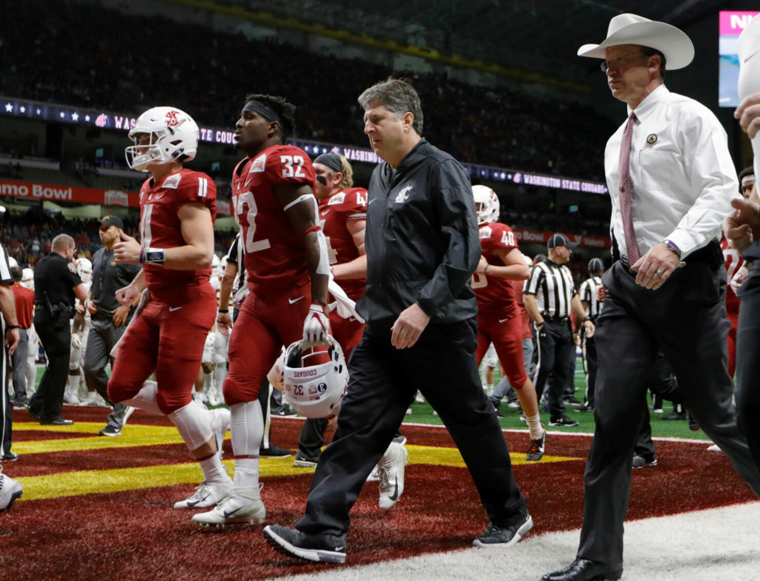  Head coach Mike Leach of the Washington State Cougars walks to the locker room 