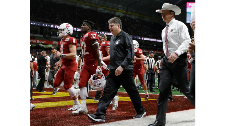  Head coach Mike Leach of the Washington State Cougars walks to the locker room 
