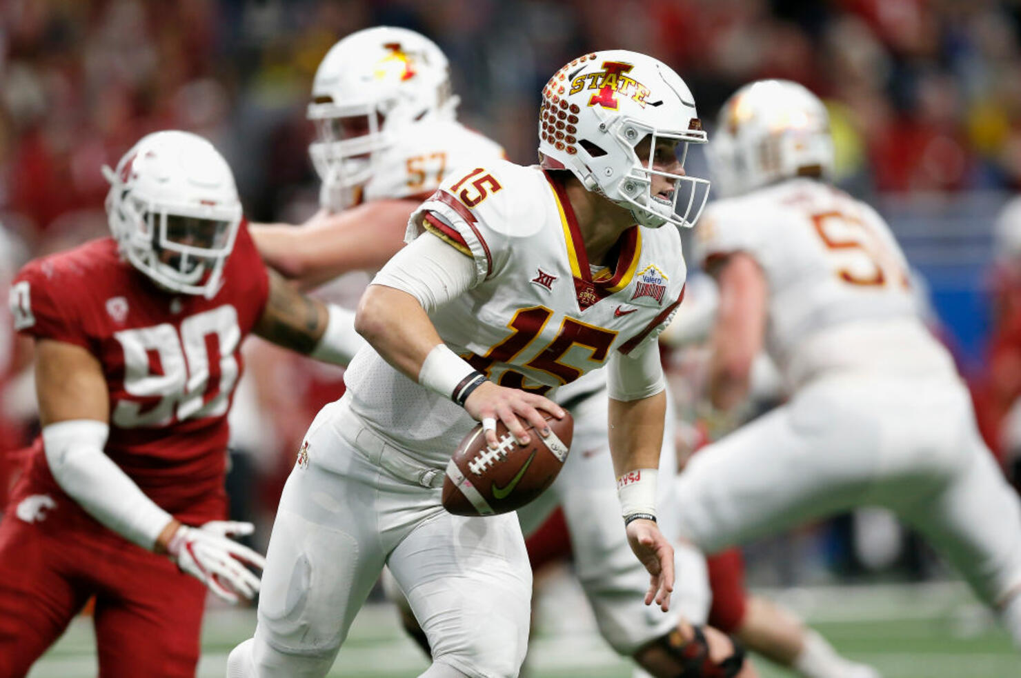 Brock Purdy #15 of the Iowa State Cyclones is forced to scramble