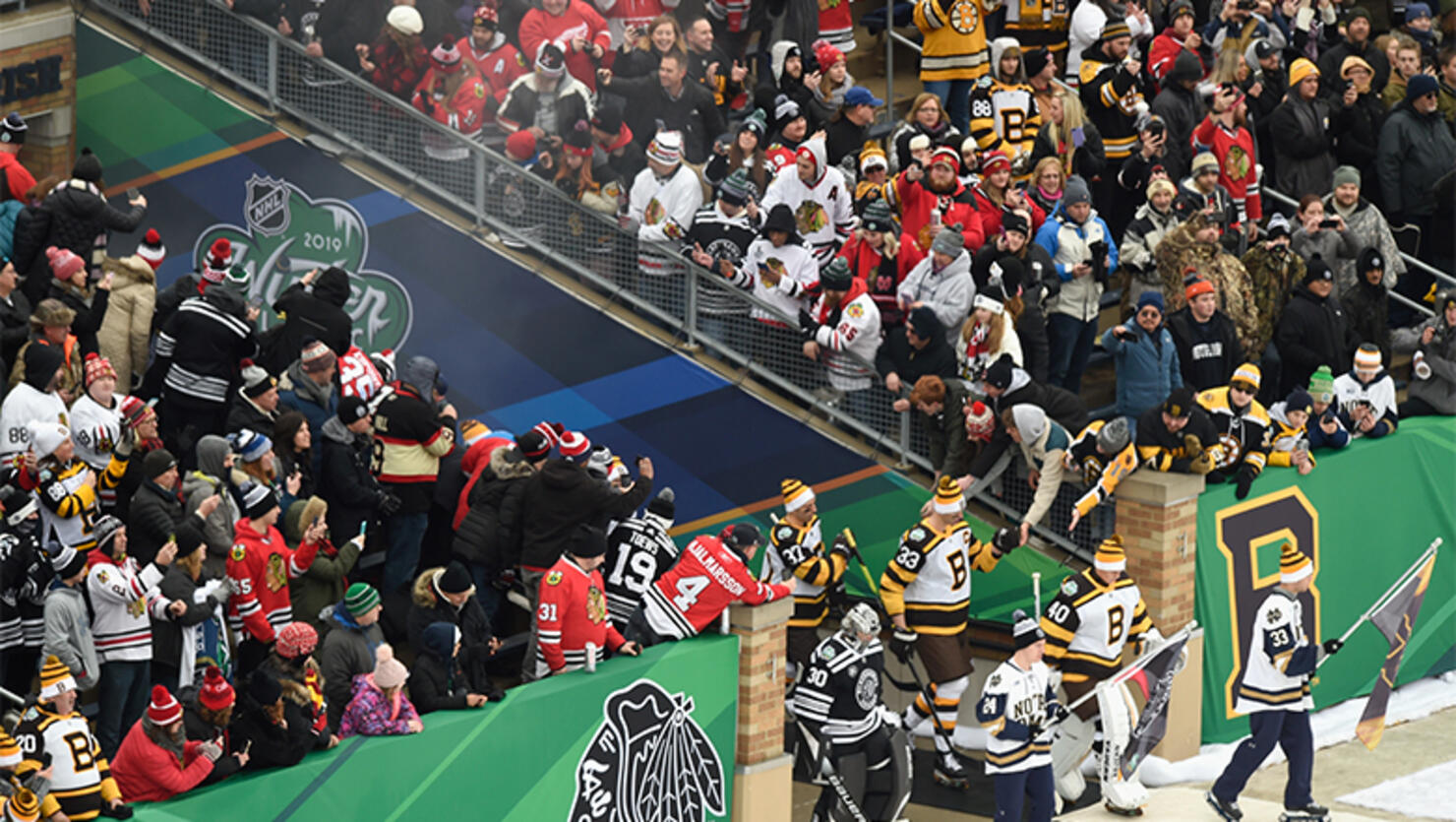 The Boston Bruins and the Chicago Blackhawks walk on to the field to play in the 2019 Bridgestone NHL Winter Classic at Notre Dame Stadium