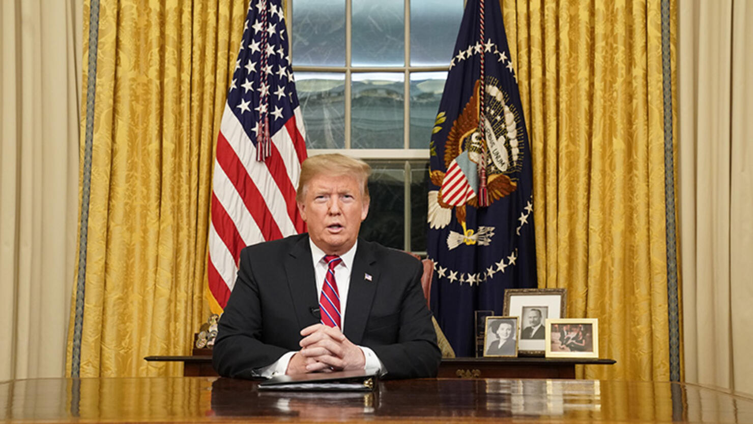 U.S. President Donald Trump speaks to the nation in his first-prime address from the Oval Office of the White House