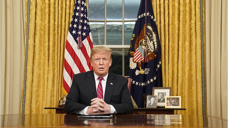U.S. President Donald Trump speaks to the nation in his first-prime address from the Oval Office of the White House