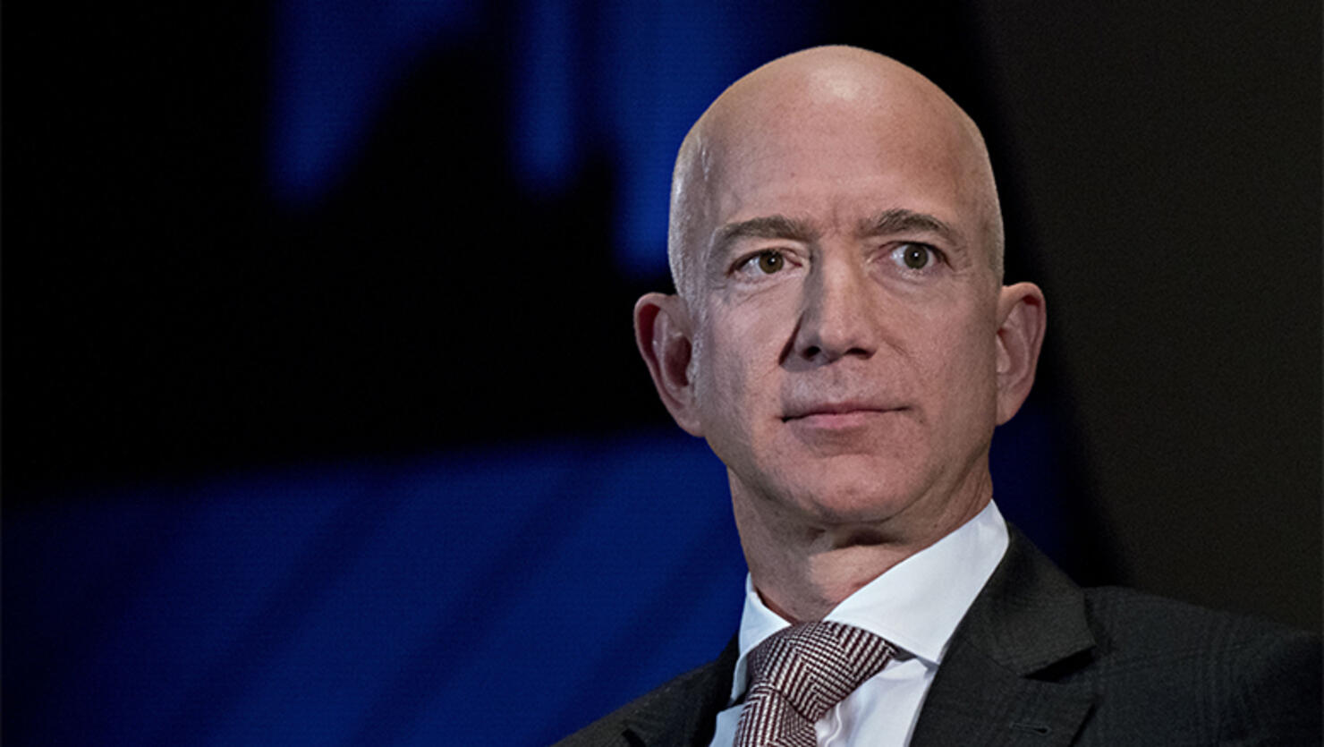 Jeff Bezos, founder and chief executive officer of Amazon.com Inc., listens during an Economic Club of Washington discussion in Washington, D.C.