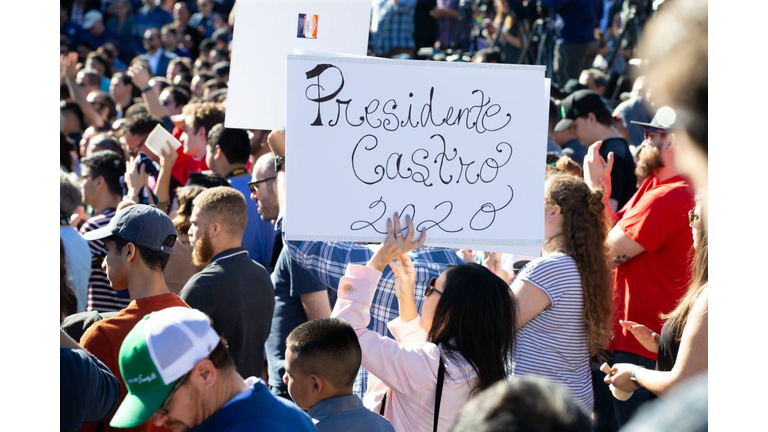 Supporters hold up signs as Juliàn Castro announces his candidacy for president of the United States 