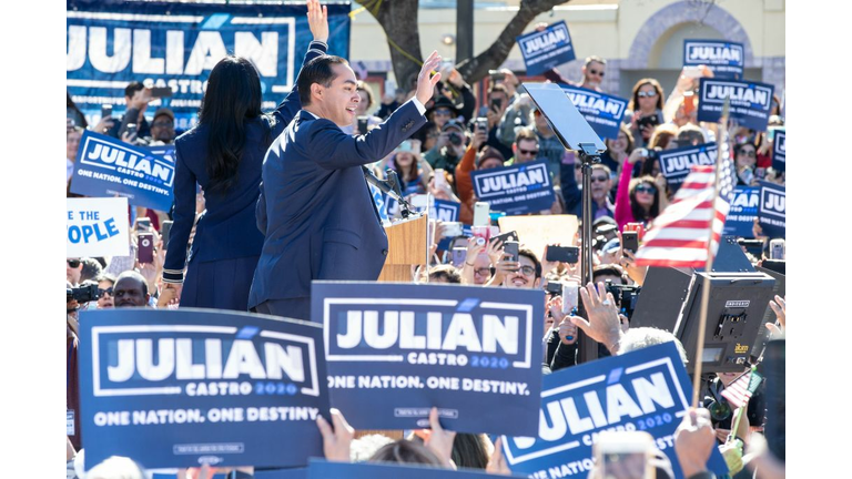Supporters hold up signs as Juliàn Castro announces his candidacy for president of the United States 