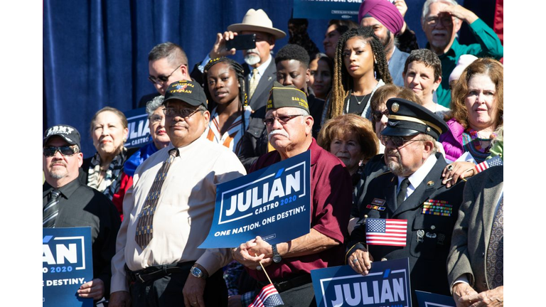Supporters hold up signs as Juliàn Castro announces his candidacy for president of the United States 