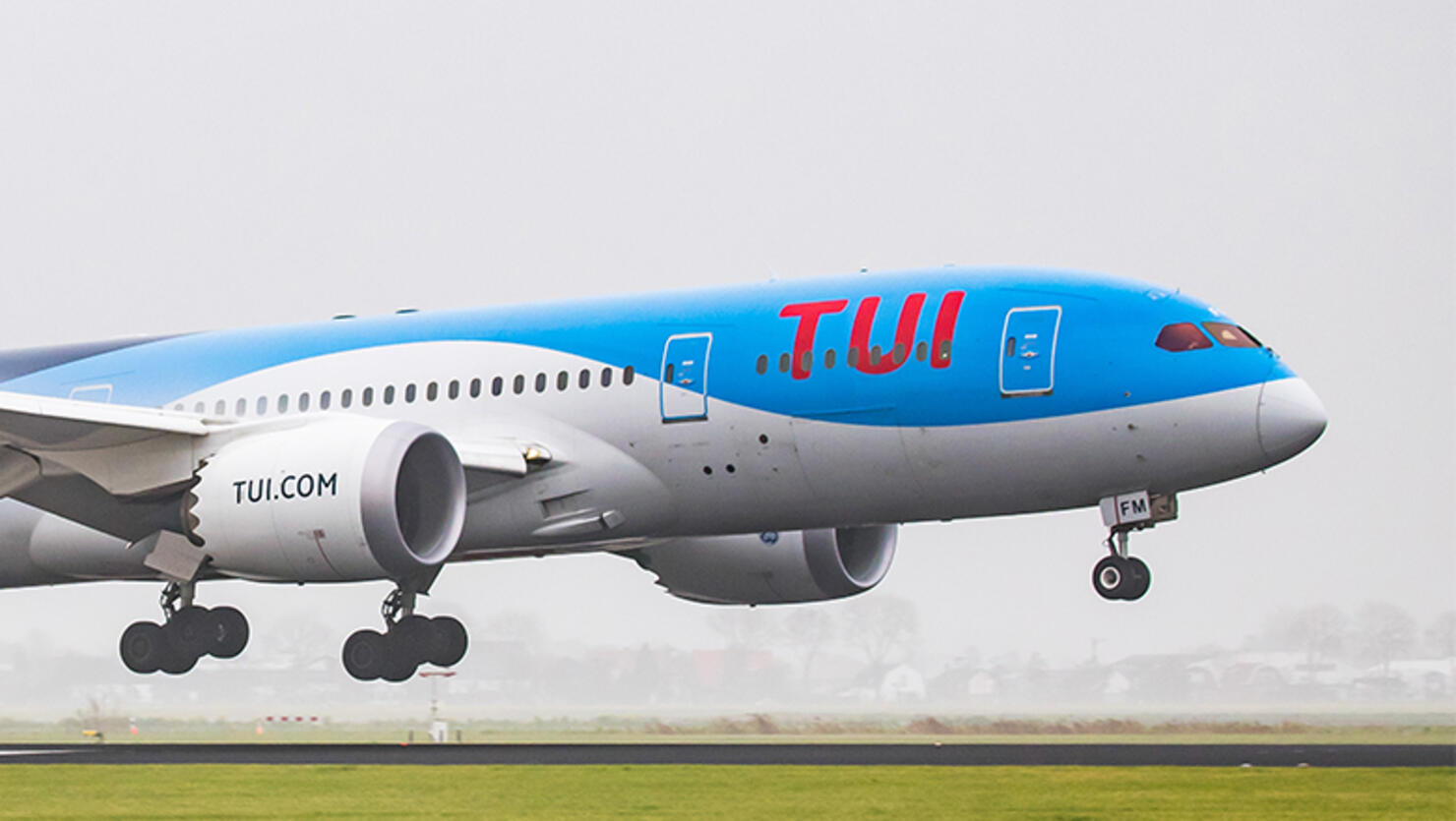 TUI Airlines Netherlands Boeing 787-8 Dreamliner landing in the mist in Amsterdam Schiphol International Airport