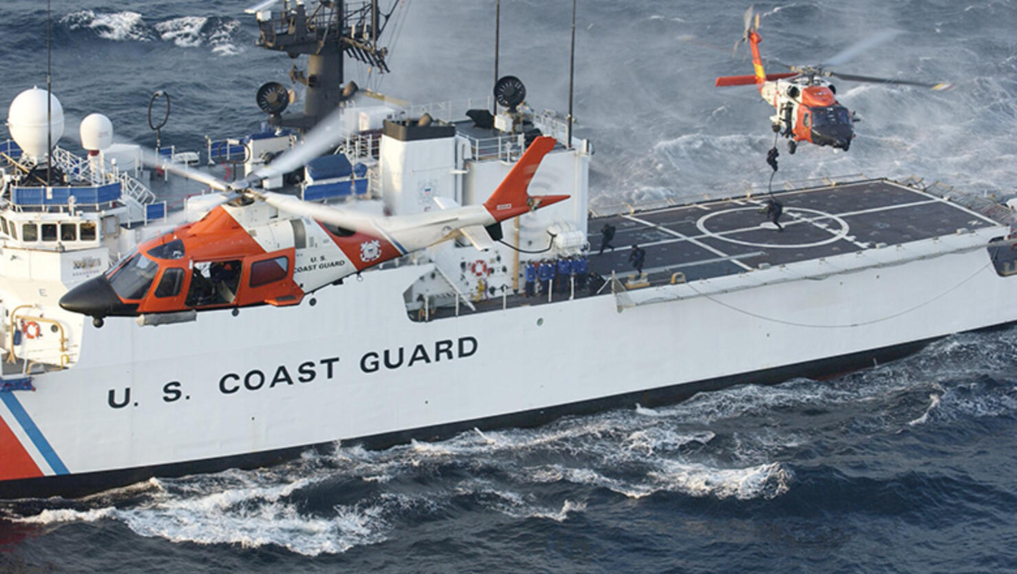 In this handout image provided by the U.S. Coast Guard, a Coast Guard maritime security force practices fast-roping to the Coast Guard cutter Seneca's flight deck 