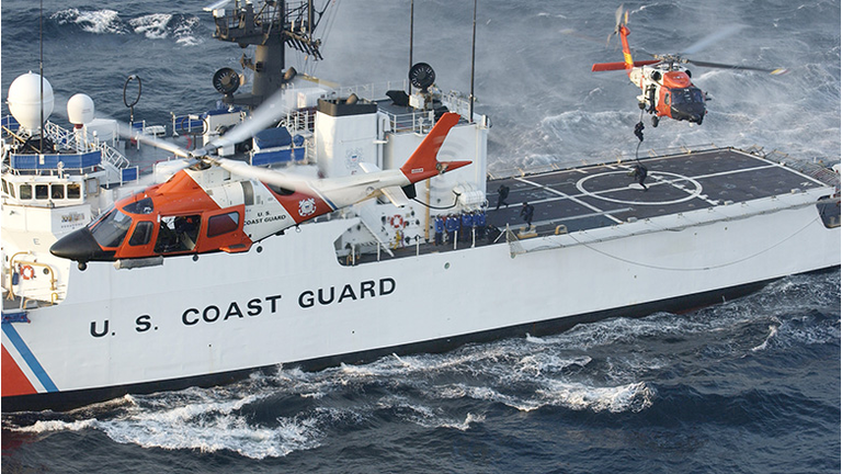 In this handout image provided by the U.S. Coast Guard, a Coast Guard maritime security force practices fast-roping to the Coast Guard cutter Seneca's flight deck 