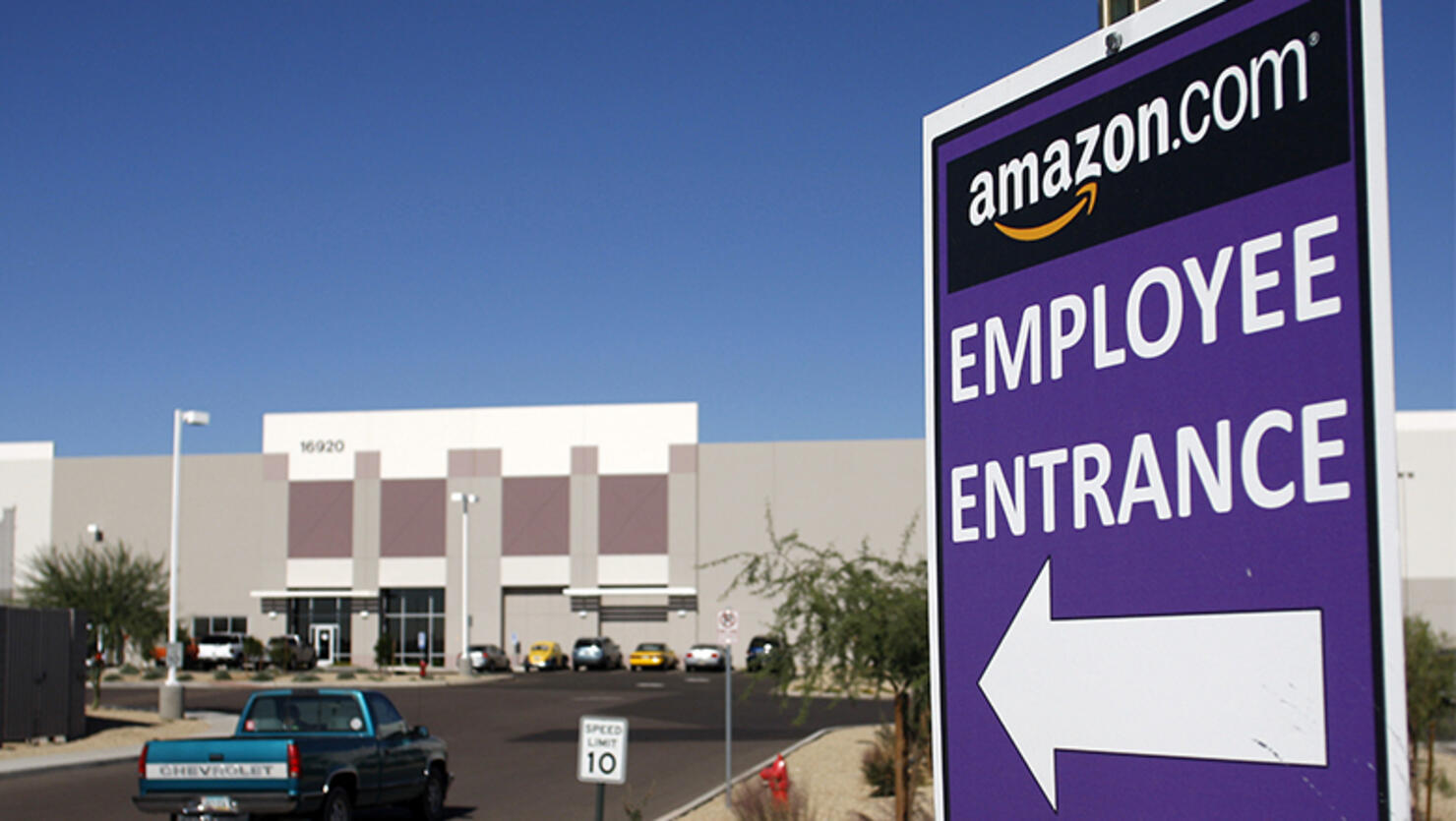 A vehicle enters the Amazon.com Phoenix Fulfillment Center parking lot in Goodyear, Arizona