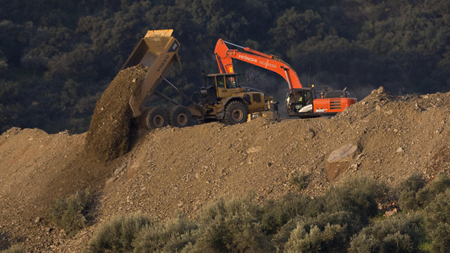 Rescue workers continue efforts to find a boy who fell down a well in Totalan in southern Spain