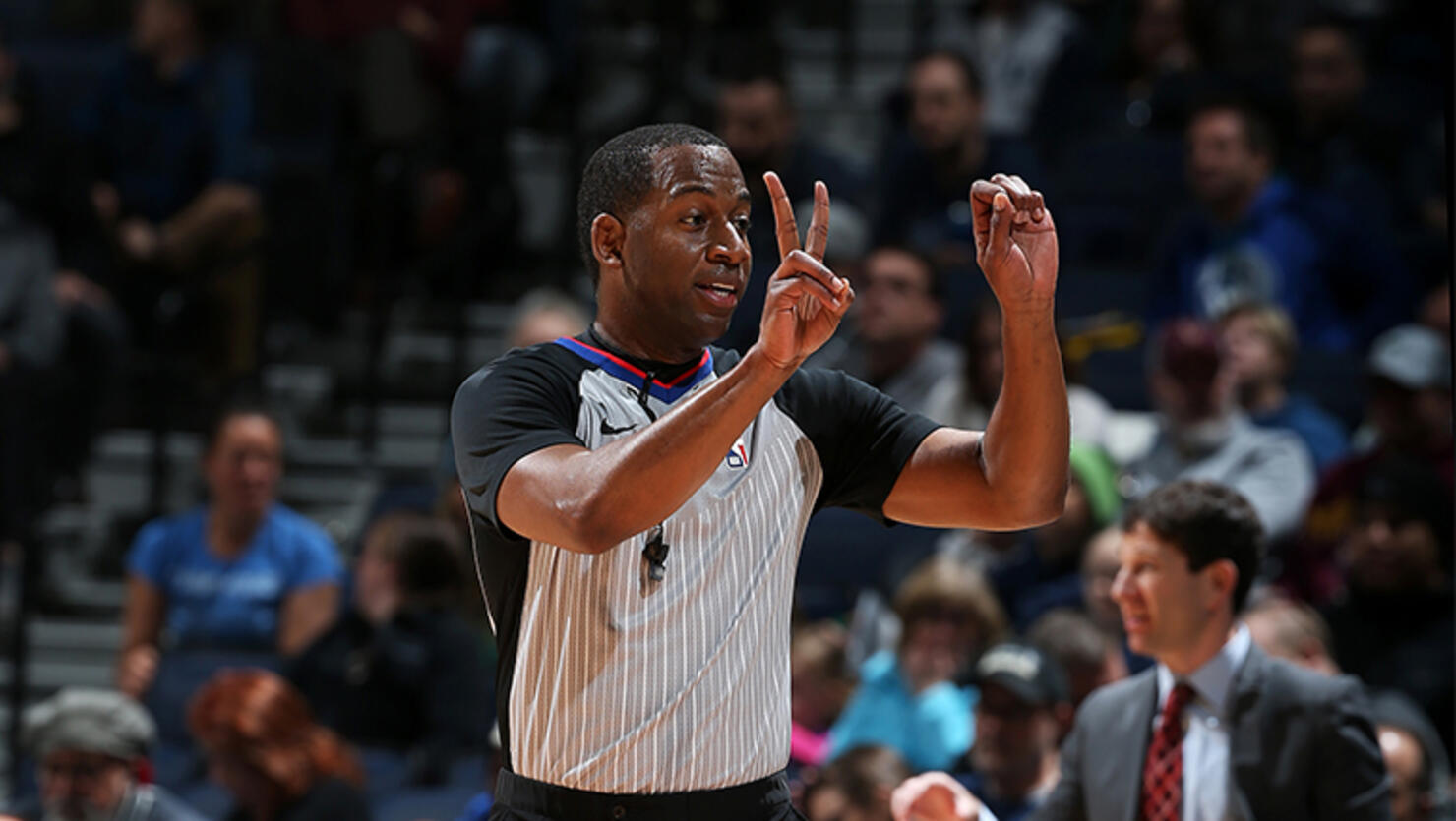 Referee official Sean Wright makes a call during the game between the New Orleans Pelicans and Minnesota Timberwolves 