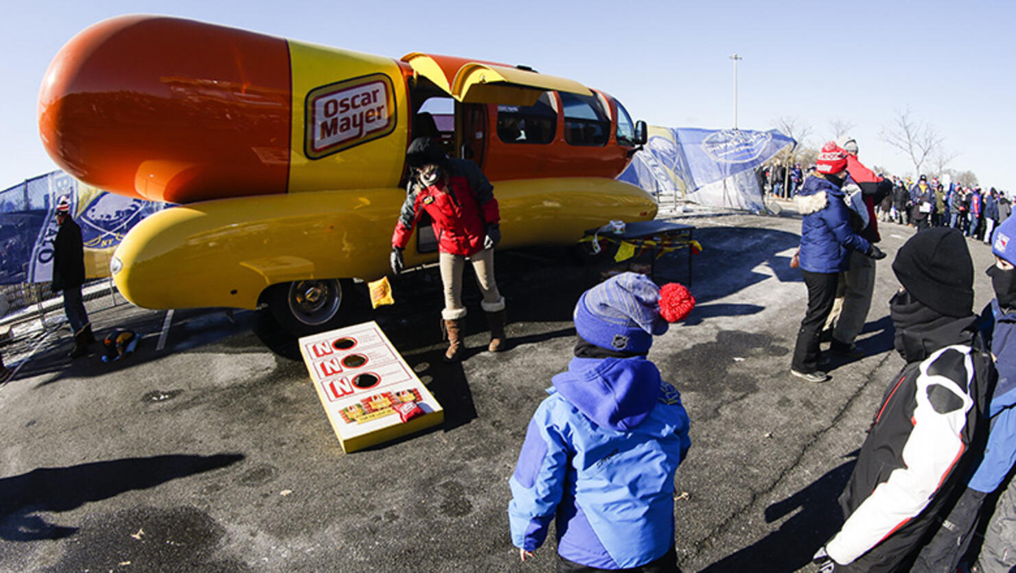  Child throws beanbag near Oscar Mayer Weinermobile prior to the New York Rangers and Buffalo Sabres Winter Classic NHL game