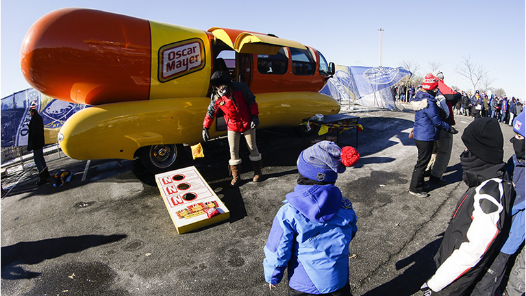  Child throws beanbag near Oscar Mayer Weinermobile prior to the New York Rangers and Buffalo Sabres Winter Classic NHL game