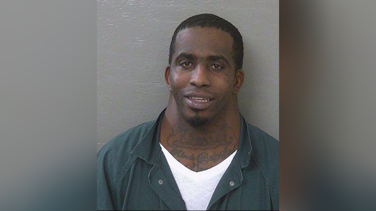 Man whose mugshot went viral back in jail
