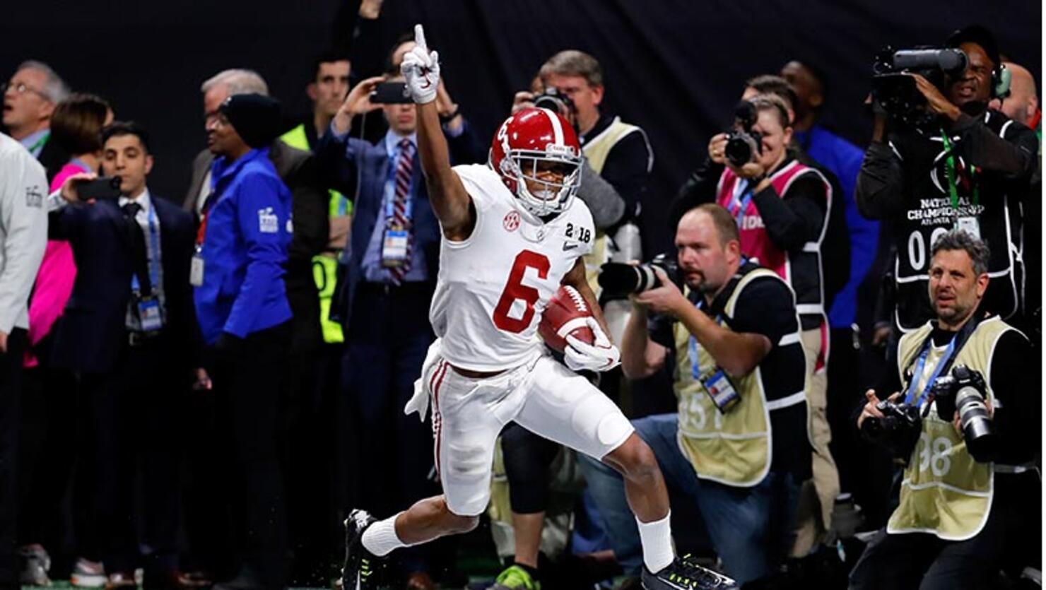  DeVonta Smith #6 of the Alabama Crimson Tide celebrates catching a 41 yard touchdown pass to beat the Georgia Bulldogs in the CFP National Championship presented by AT&T in overtime at Mercedes-Benz Stadium on January 8, 2018 in Atlanta, Georgia