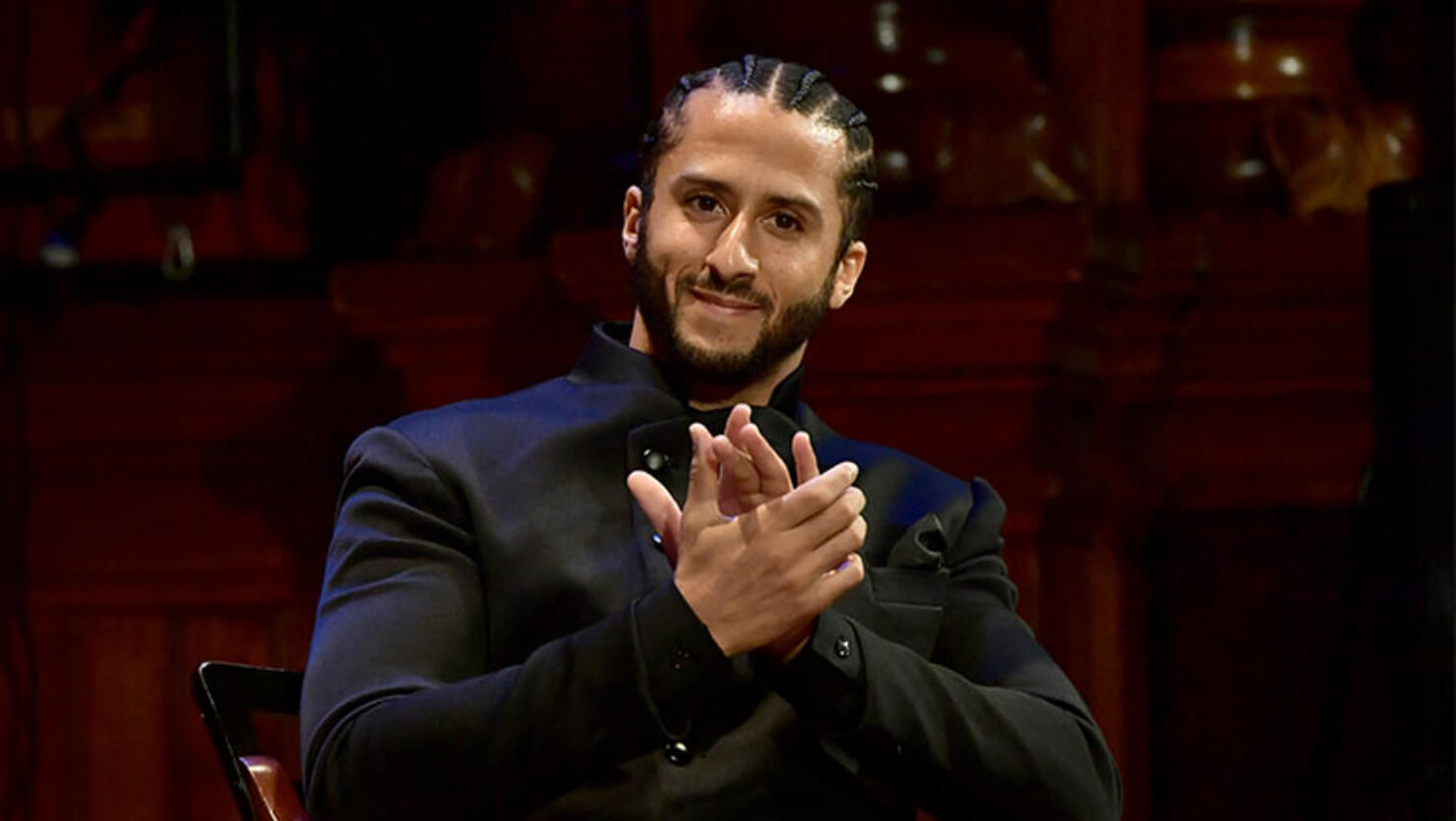 Colin Kaepernick on stage at the W.E.B. Du Bois Medal Award Ceremony at Harvard University 