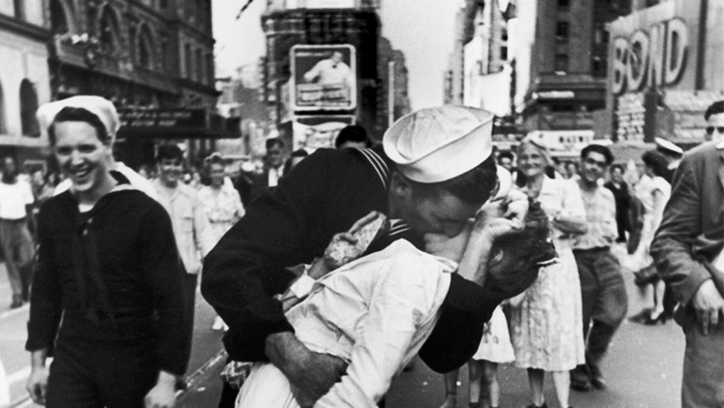  A jubilant American sailor clutching a white-uniformed nurse in a back-bending, passionate kiss as he vents his joy while thousands jam Times Square to celebrate the long awaited-victory over Japan