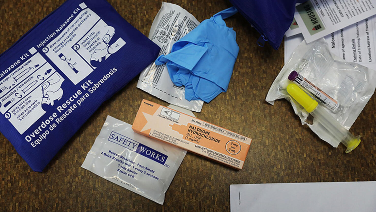 The contents of an overdose rescue kit are displayed in a class on overdose prevention held by non-profit Positive Health Project