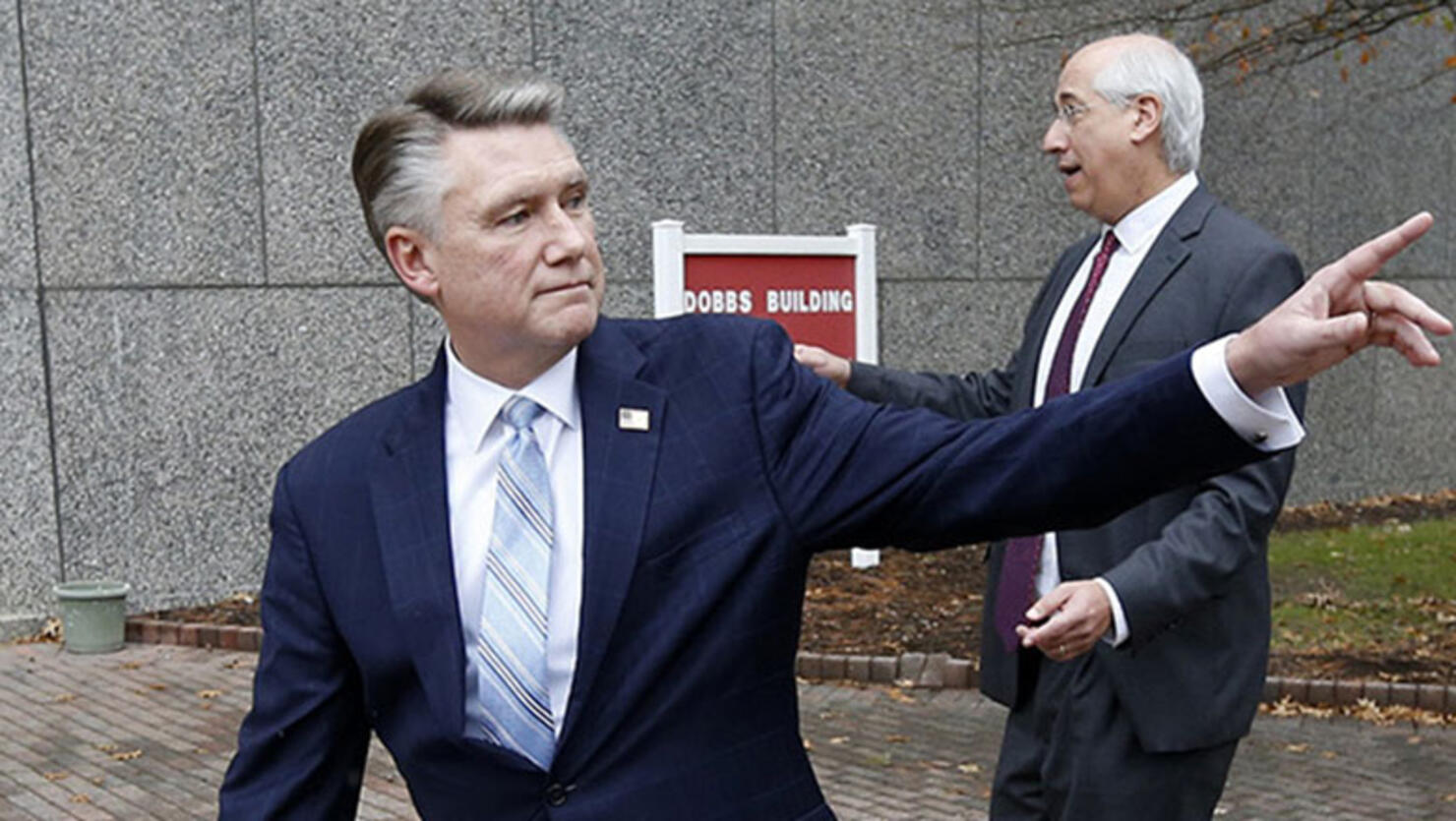 Republican Mark Harris, left, and his attorney David Freedman leave after speaking with the media following a meeting with state election investigators 