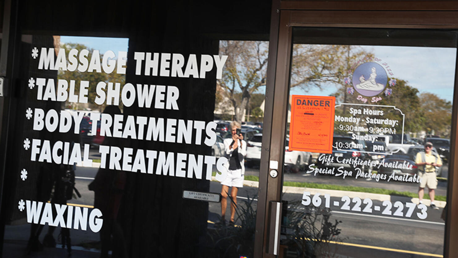 A Danger sign is seen on the front door of the Orchids of Asia Day Spa after New England Patriots owner Robert Kraft is charged with allegedly soliciting for sex
