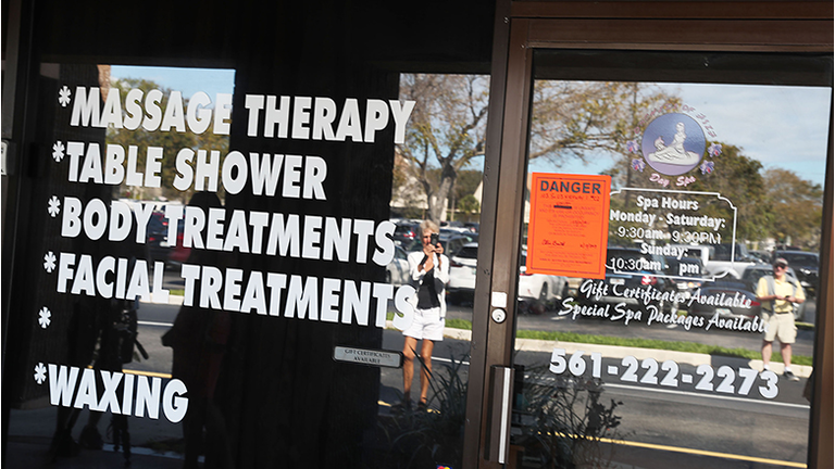 A Danger sign is seen on the front door of the Orchids of Asia Day Spa after New England Patriots owner Robert Kraft is charged with allegedly soliciting for sex