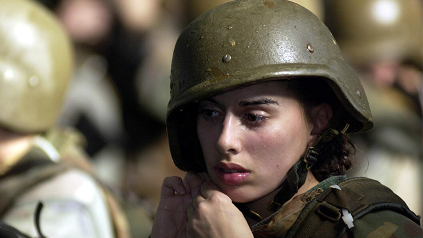 United States Marine Corps female recruit Stephanie Palladino adjusts her Kevlar helmet