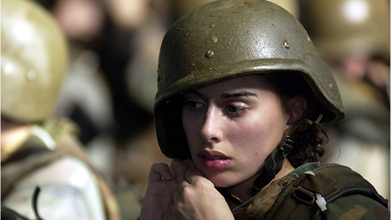 United States Marine Corps female recruit Stephanie Palladino adjusts her Kevlar helmet