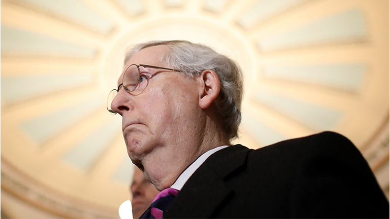 Senate Majority Leader Sen. Mitch McConnell (R-KY) listens to questions from reporters following the weekly Republican policy luncheon at the U.S. Capitol