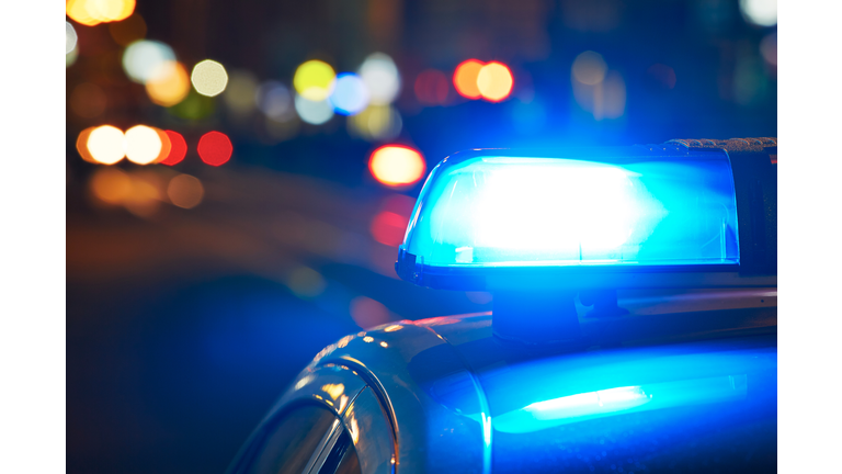 Close-Up Of Illuminated Cars On Street At Night