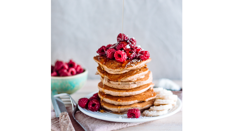 Stack of raspberry and maple syrup pancakes