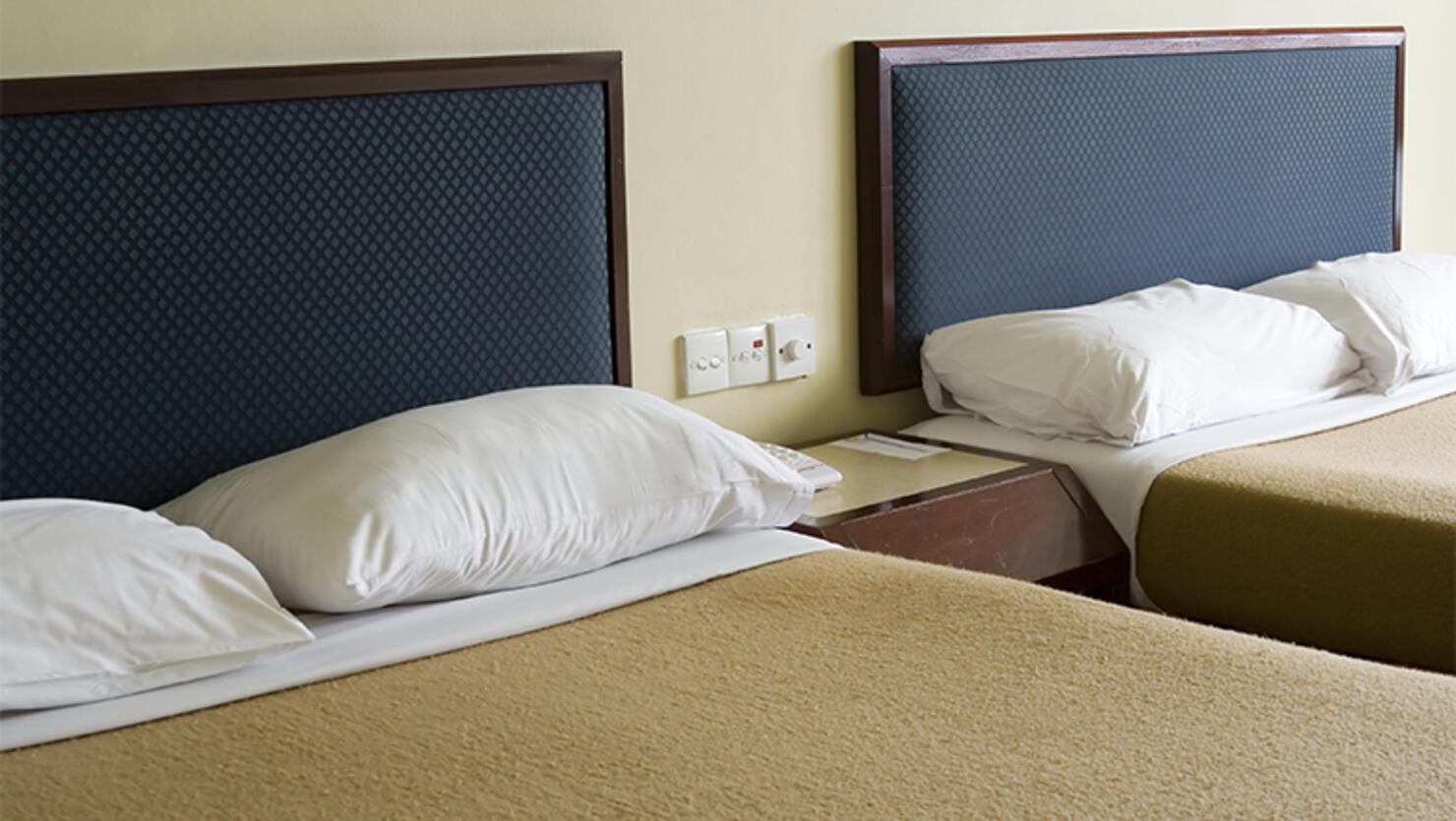 Two beds in a hotel room
