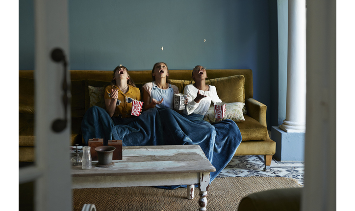 3 friends catching popcorn with the mouth