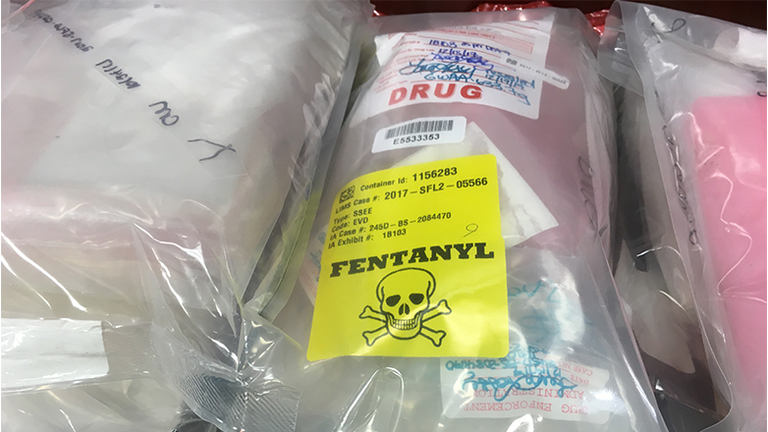 Bags of drugs are displayed on a table during a press conference held by the United States Attorney's Office at the John Joseph Moakley United States Courthouse in Boston
