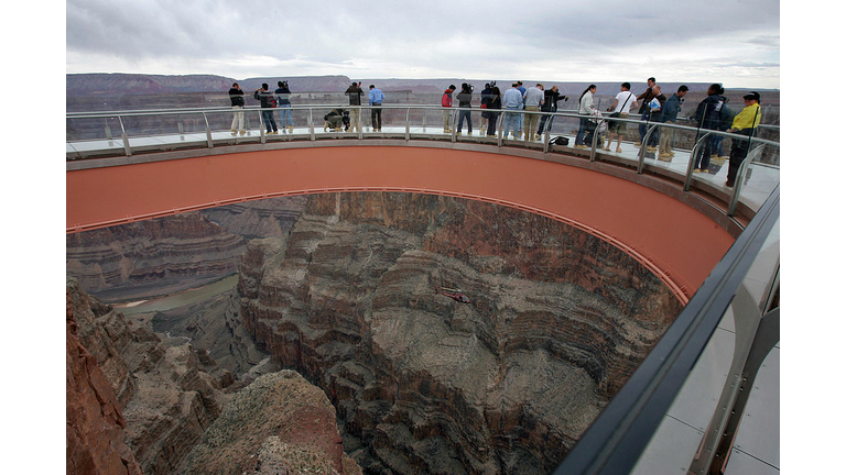 Visitors walk on the Skywalk at Grand Ca